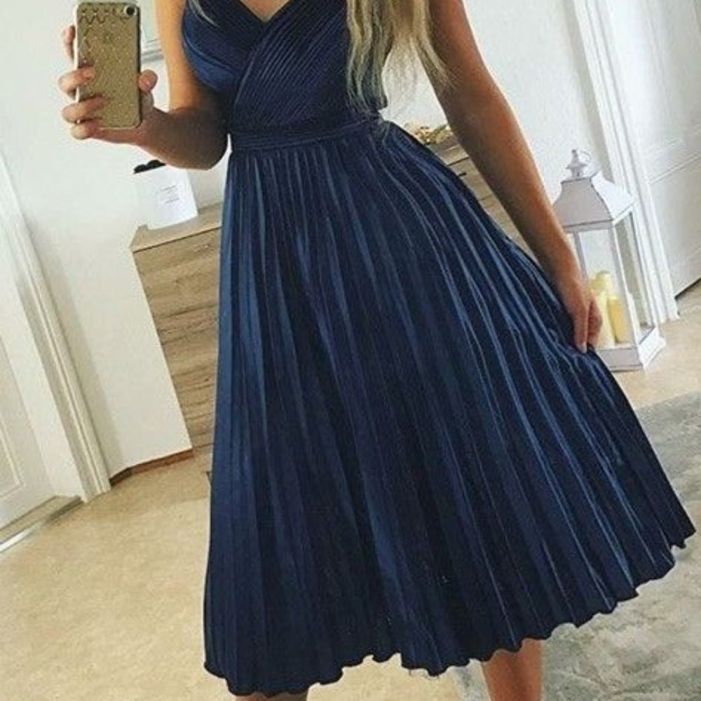 Blue spaghetti strap blue prom dress goes a little past the knee